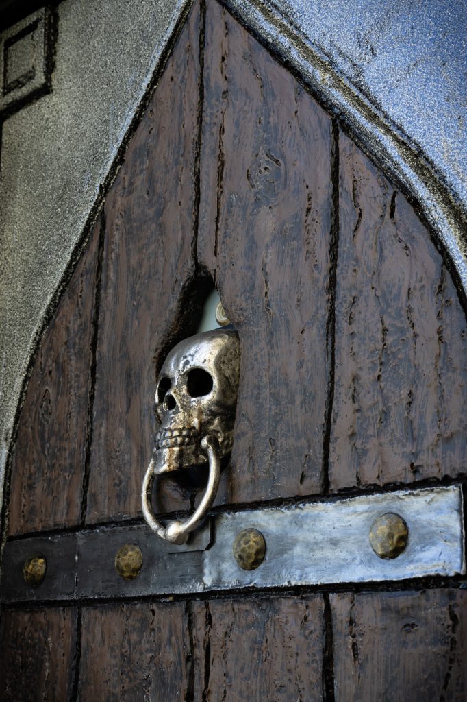 faux foam haunted door with skull knocker